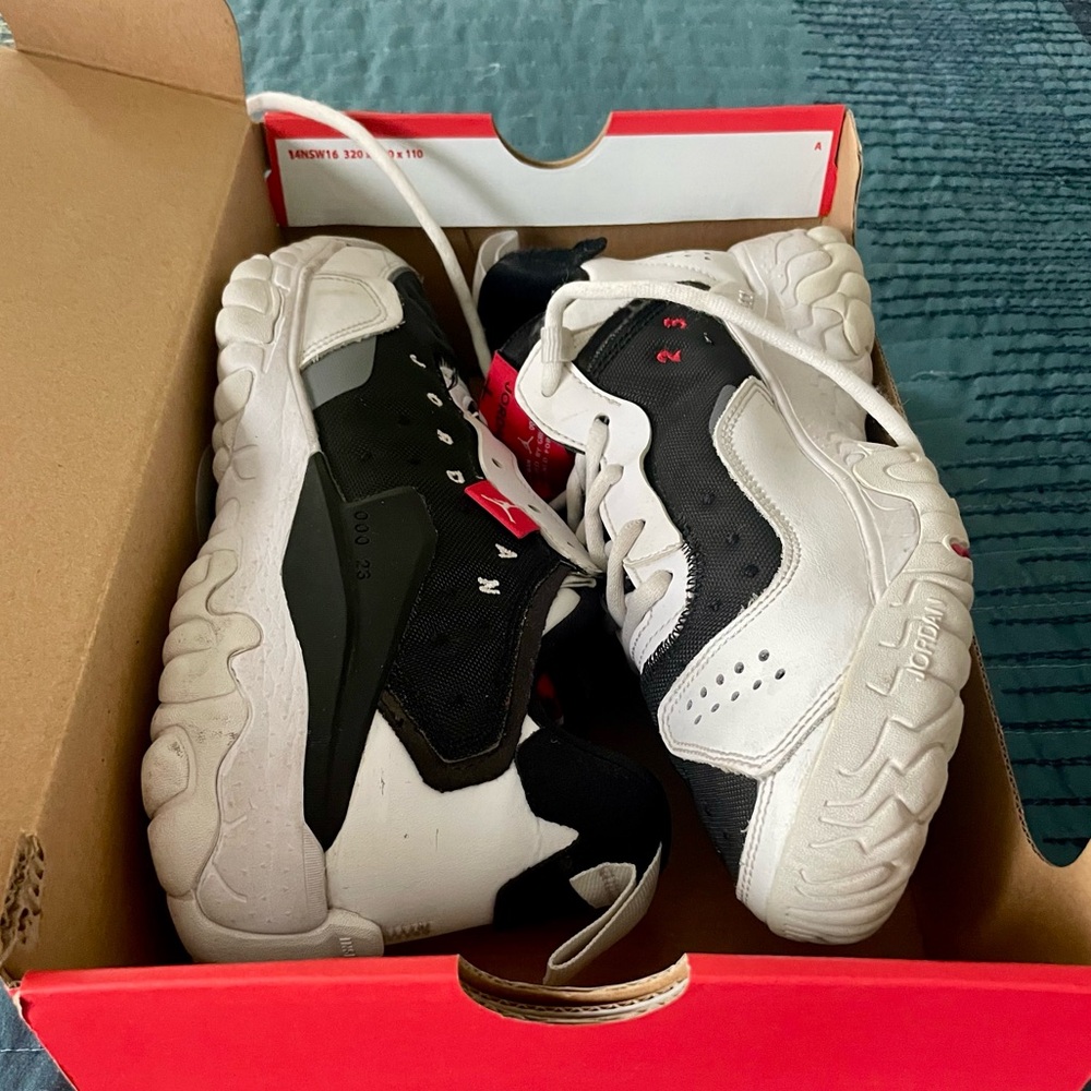 Black, red, and white Nike Jordans